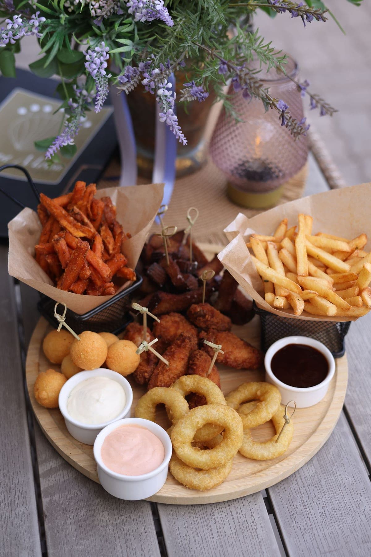 Platter of assorted fried appetizers with dipping sauces