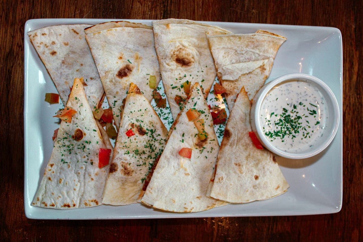 Quesadilla wedges with salsa and sour cream
