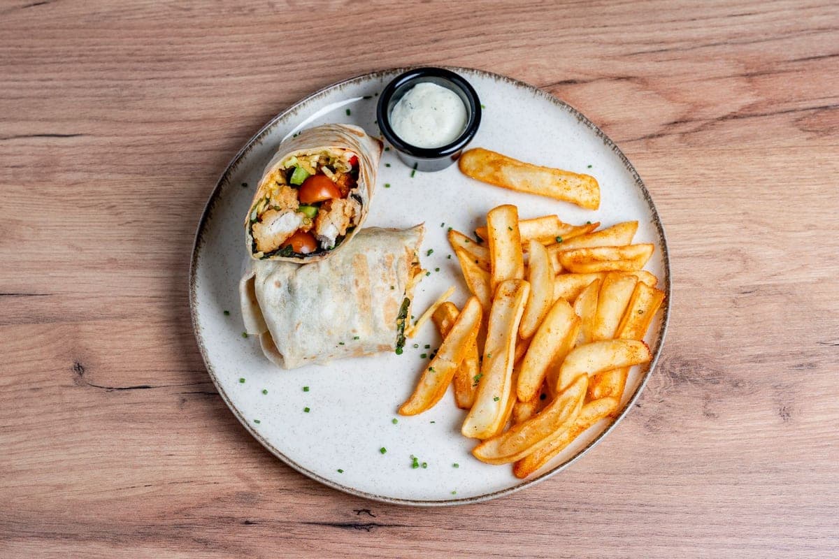 Chicken wrap served with fries