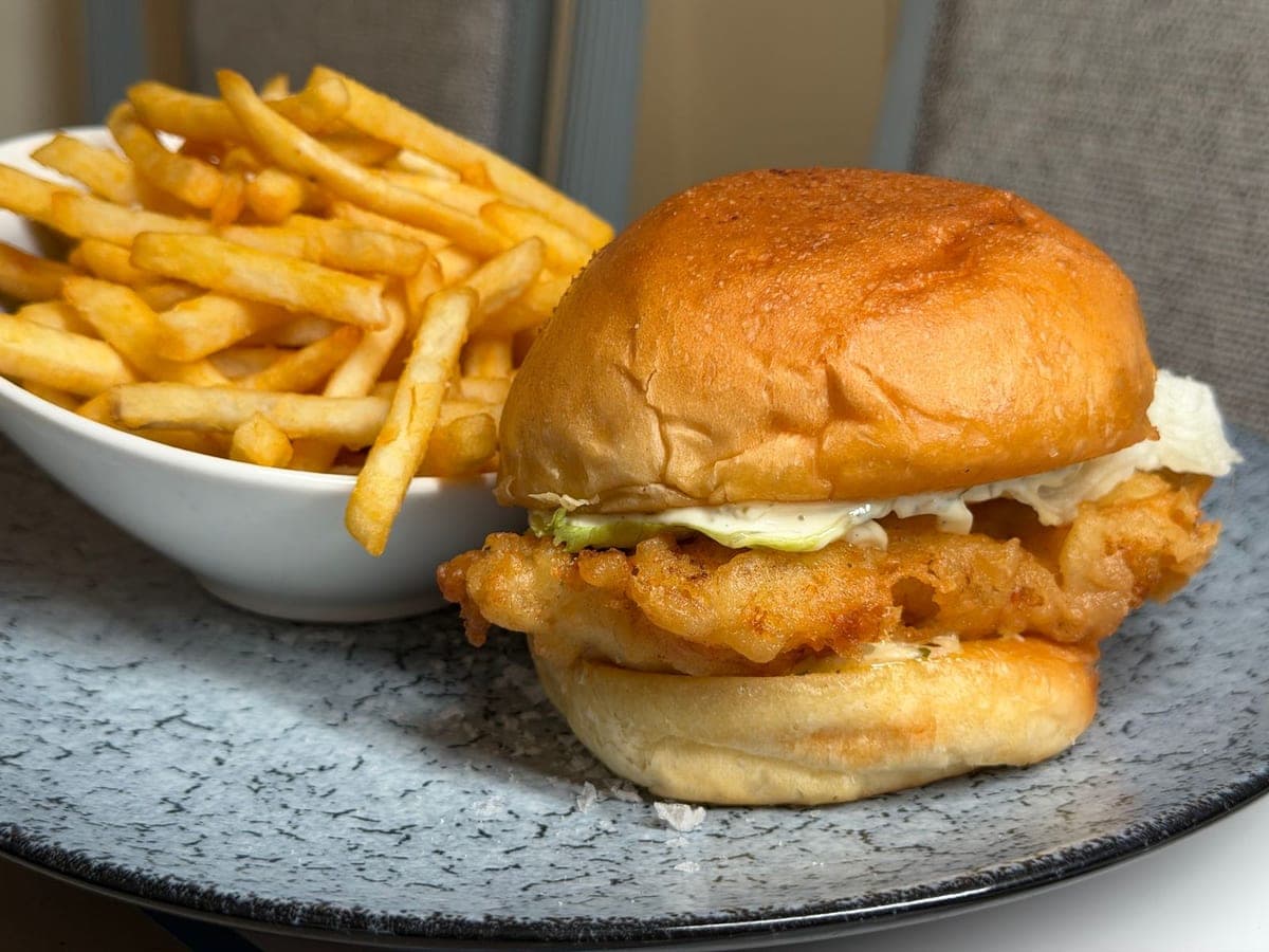 Crispy fish sandwich with fries
