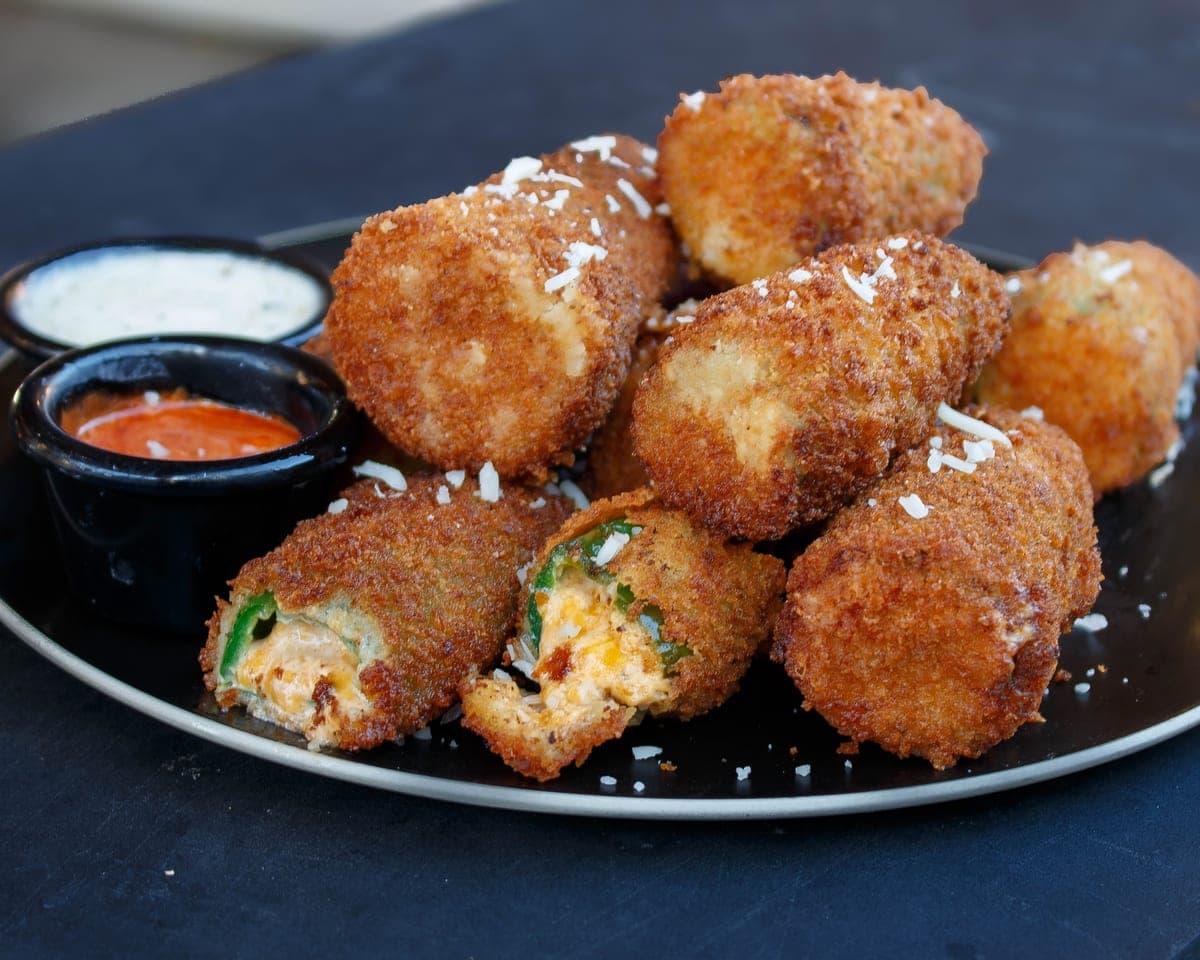 Fried jalapeño poppers with dipping sauces
