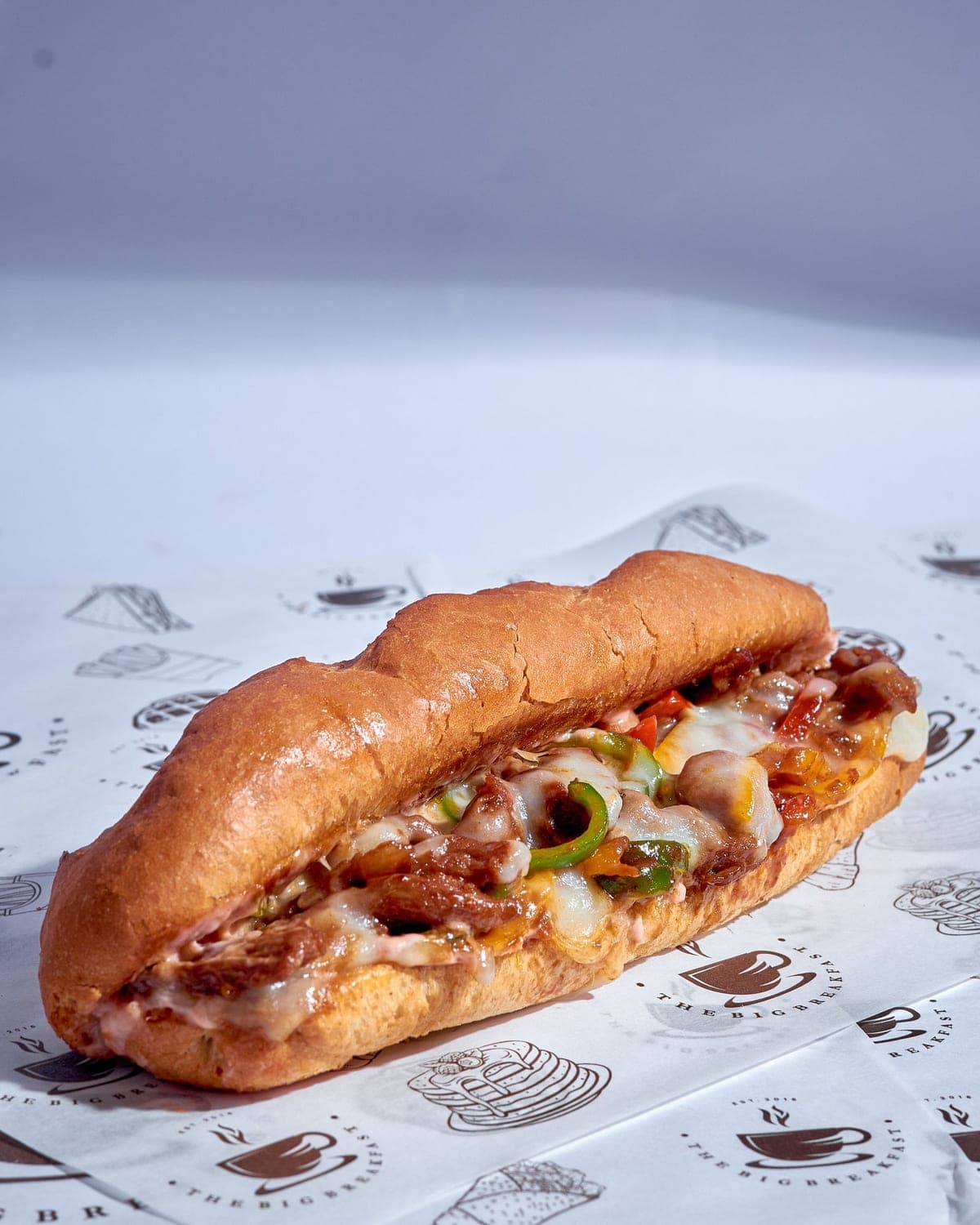 Philly cheesesteak with melted cheese, onions and peppers
