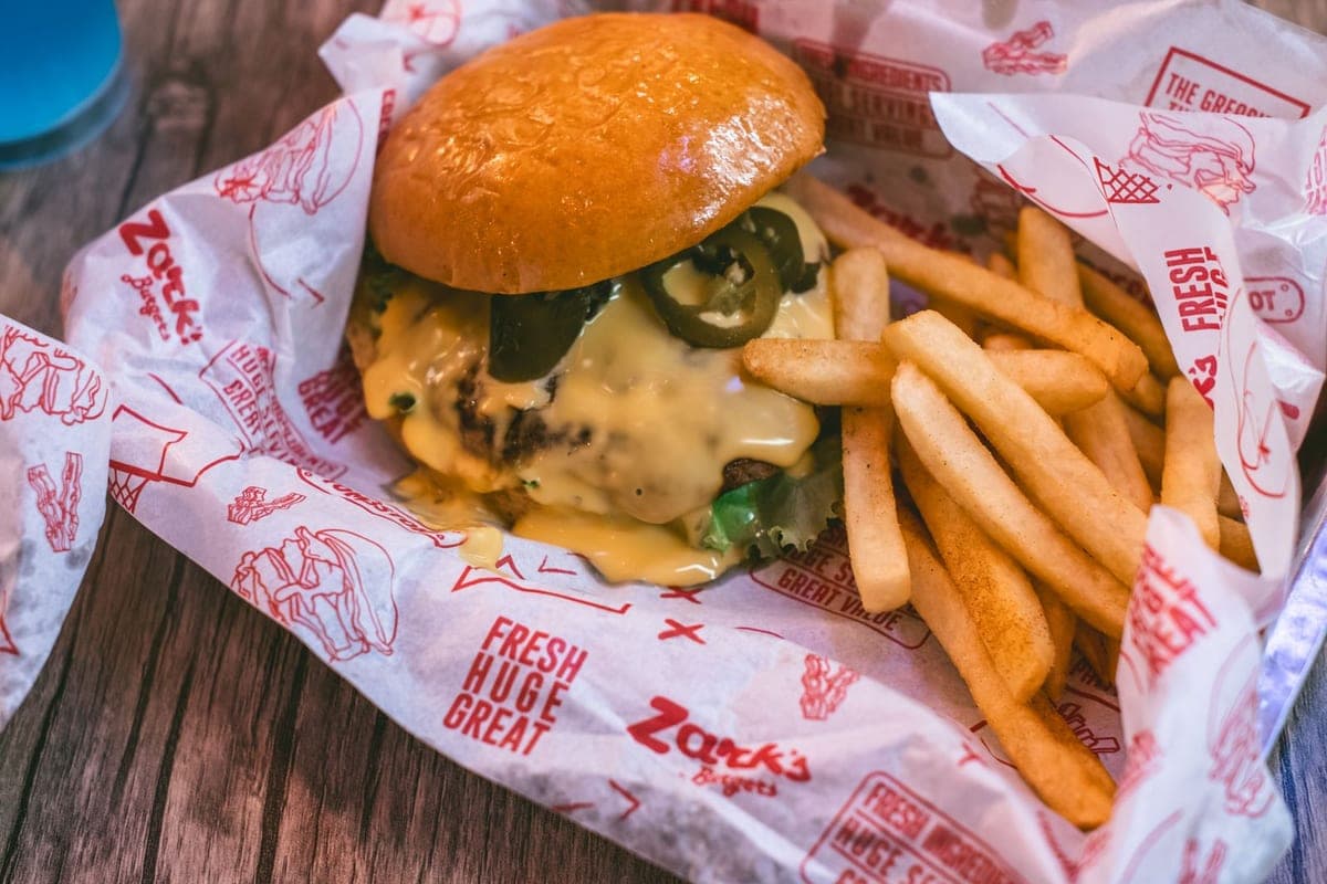 Cheeseburger topped with jalapeños, served with fries